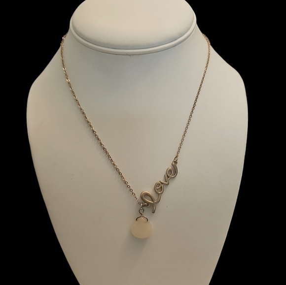 Elegant Gold Necklace with Milk Glass Teardrop Pendant and Circular Accents - Picture 5 of 5